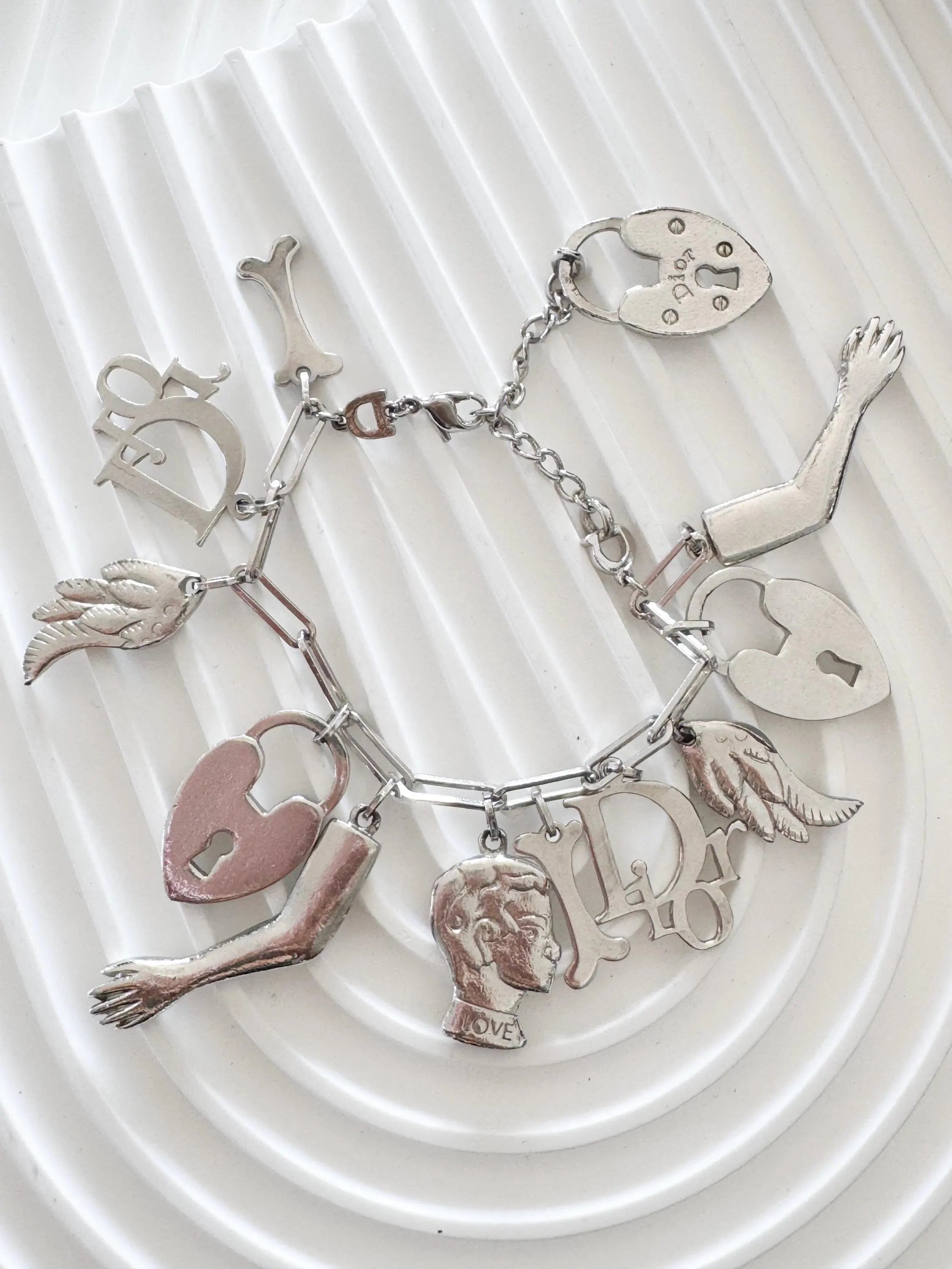 Vintage Christian Dior Silver Tone Logo Bracelet Vintage Multi-Charms Heart Lock John Galliano time, Statement bracelet, Vintage Jewelry