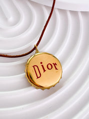 Christian Dior bottle cap necklace, vintage 1990s gold logo pendant designed by John Galliano, rare Dior jewelry