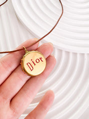 Christian Dior bottle cap necklace, vintage 1990s gold logo pendant designed by John Galliano, rare Dior jewelry
