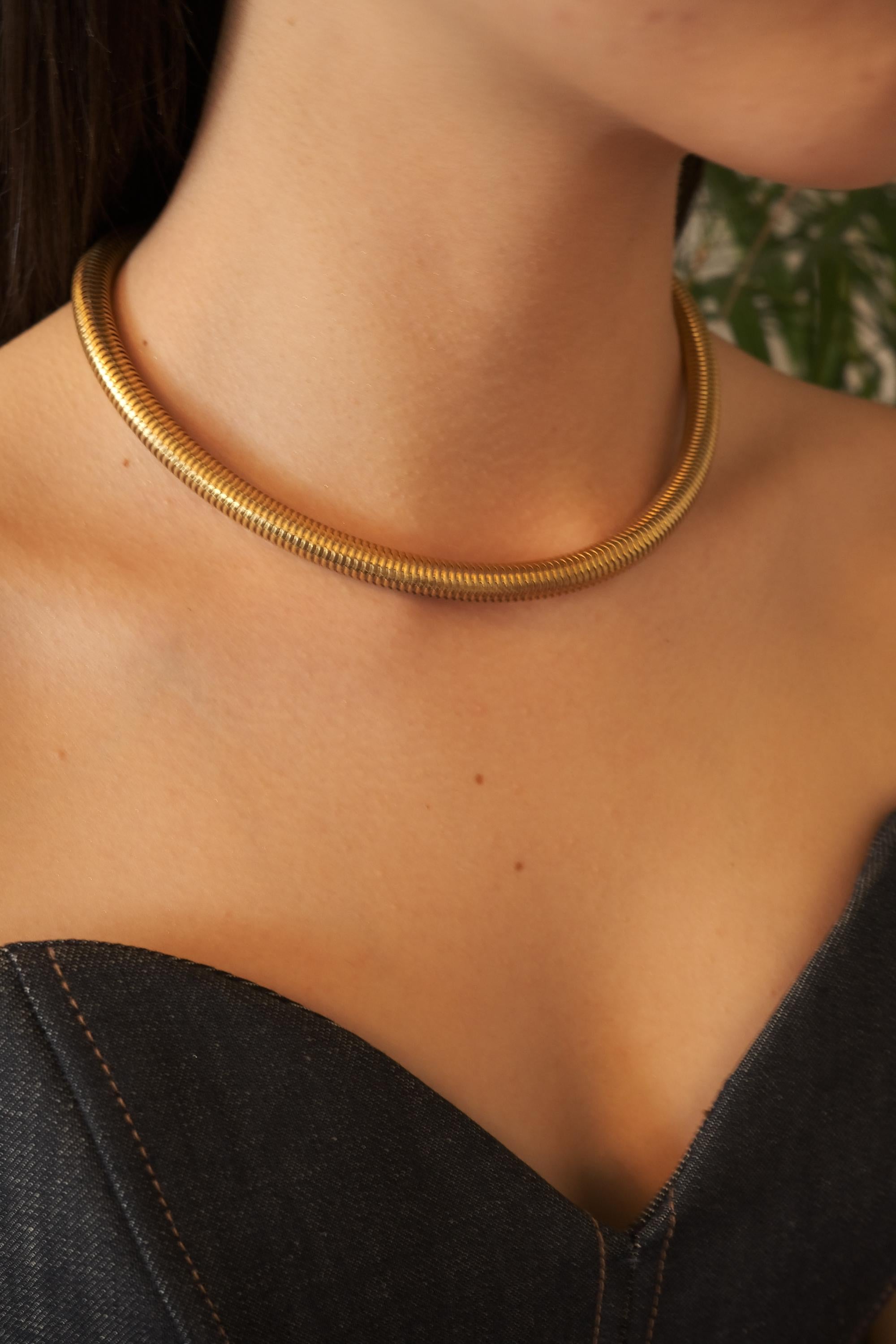 Vintage Christian Dior gold chain necklace with tubogas snake chain design, zipper choker style, unisex luxury jewelry gift