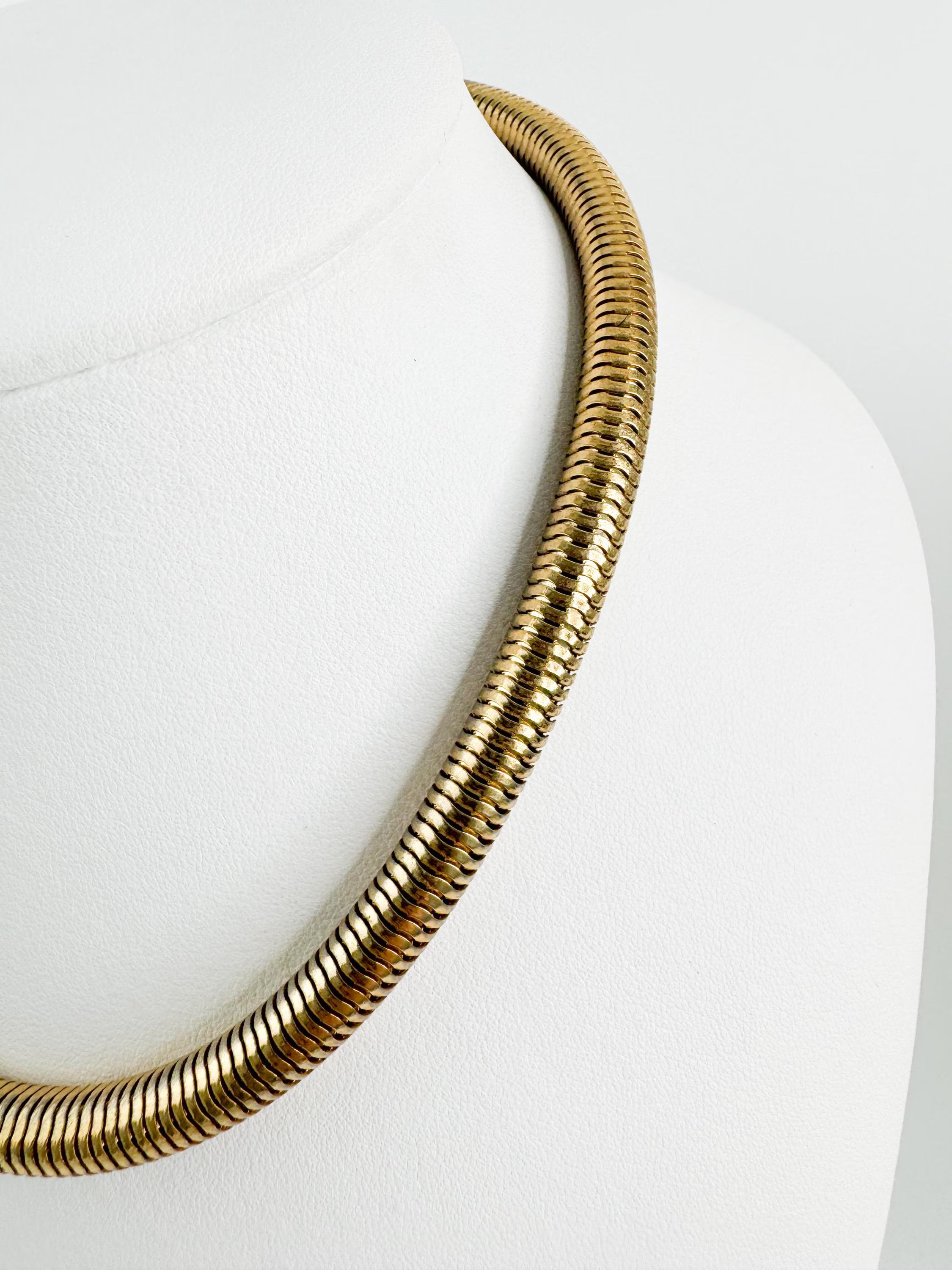 Vintage Christian Dior gold chain necklace with tubogas snake chain design, zipper choker style, unisex luxury jewelry gift