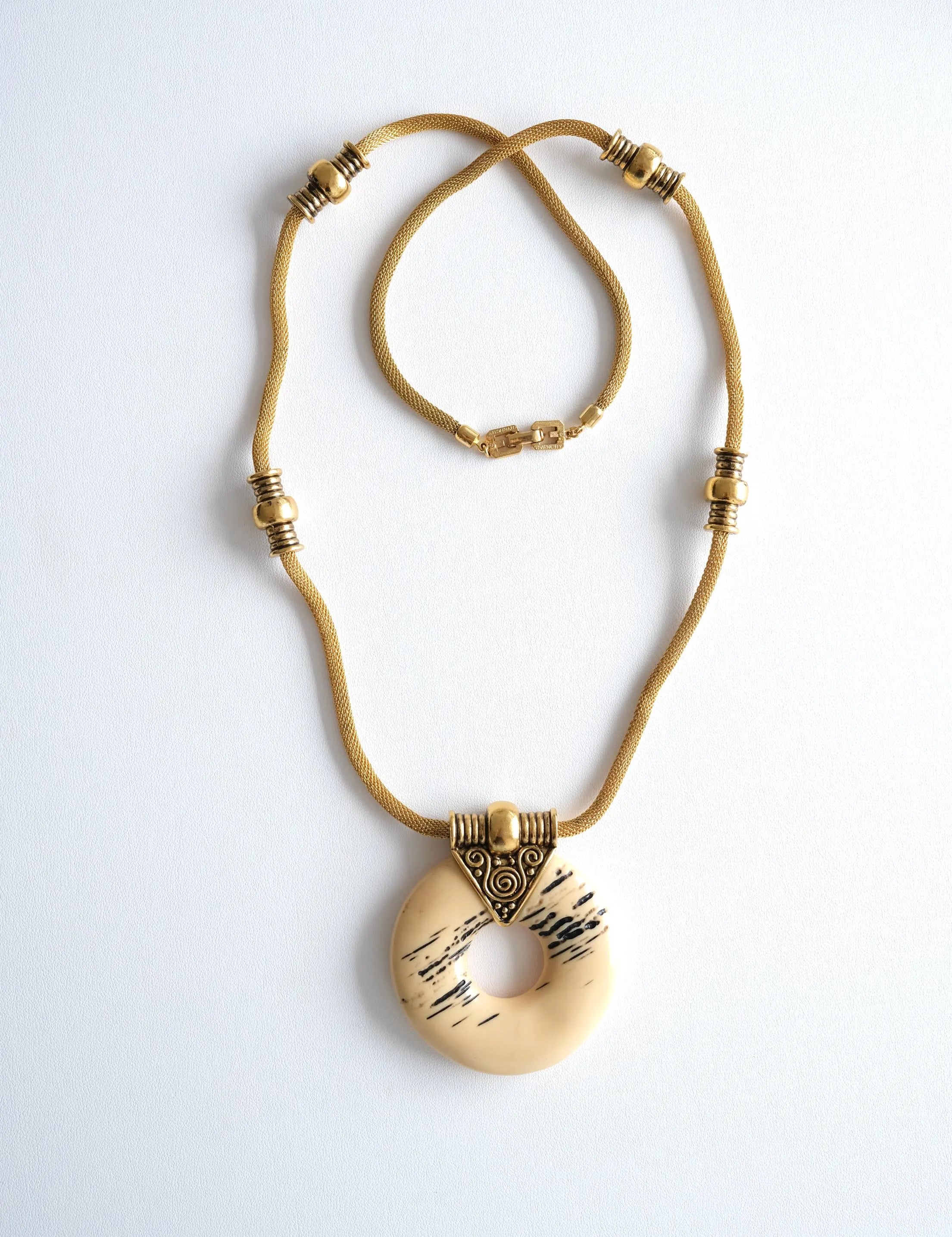 Elegant vintage Givenchy 1977 gold tone resin pendant necklace sculptural runway statement luxury jewelry