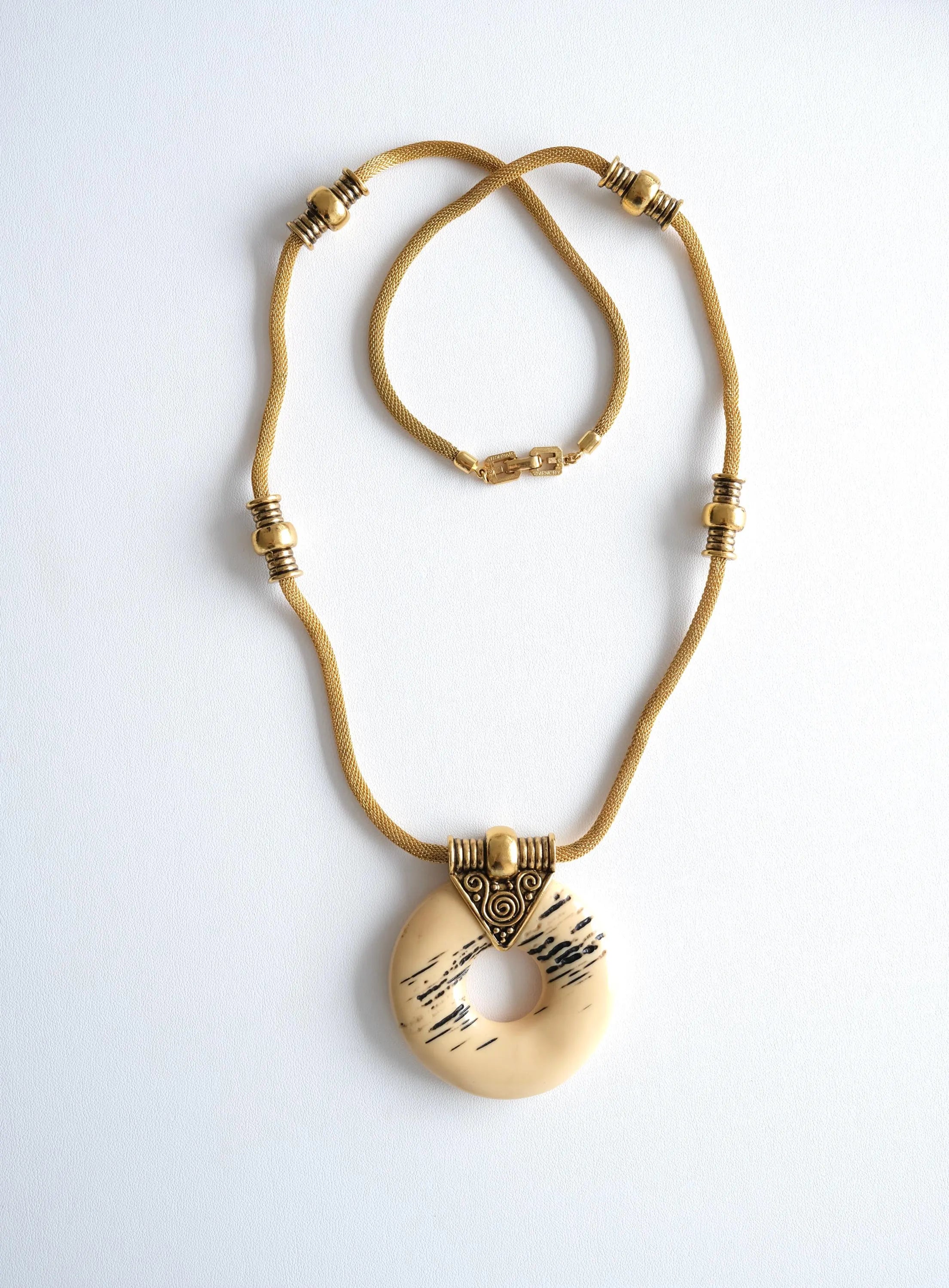 Elegant vintage Givenchy 1977 gold tone resin pendant necklace sculptural runway statement luxury jewelry