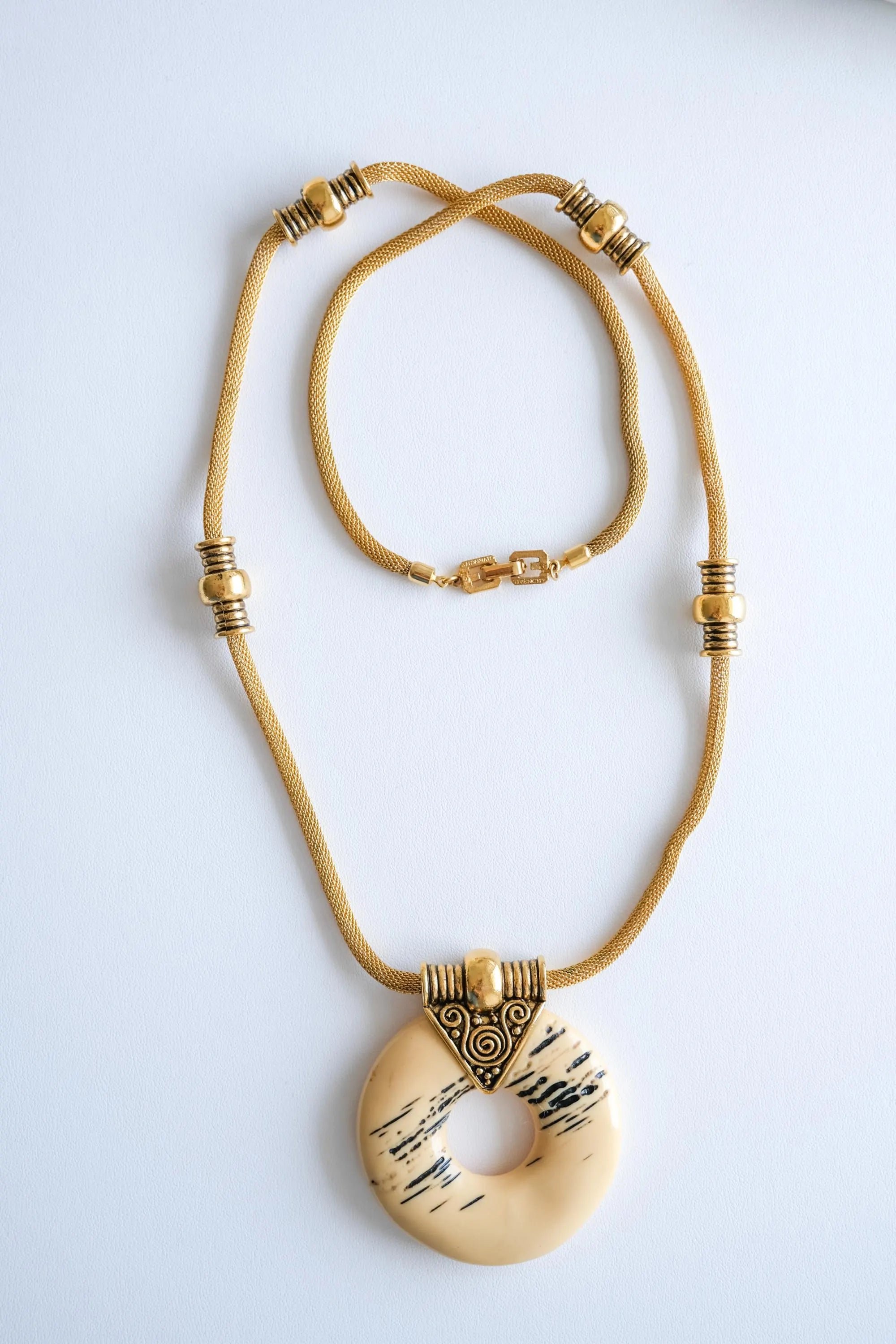 Givenchy gold resin pendant necklace sculptural statement style for sophisticated women