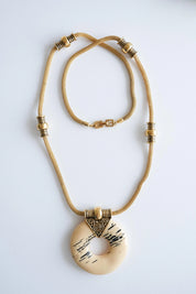 Givenchy gold resin pendant necklace sculptural statement style for sophisticated women
