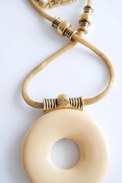 Vintage Givenchy 1977 gold resin pendant necklace sculptural timeless elegant luxury