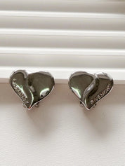 Elegant vintage Givenchy Paris silver tone heart earrings logo refined everyday luxury jewelry