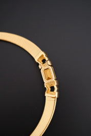 Rare vintage Christian Dior gold-tone ribbed choker necklace with smoky brown faceted crystal centerpiece