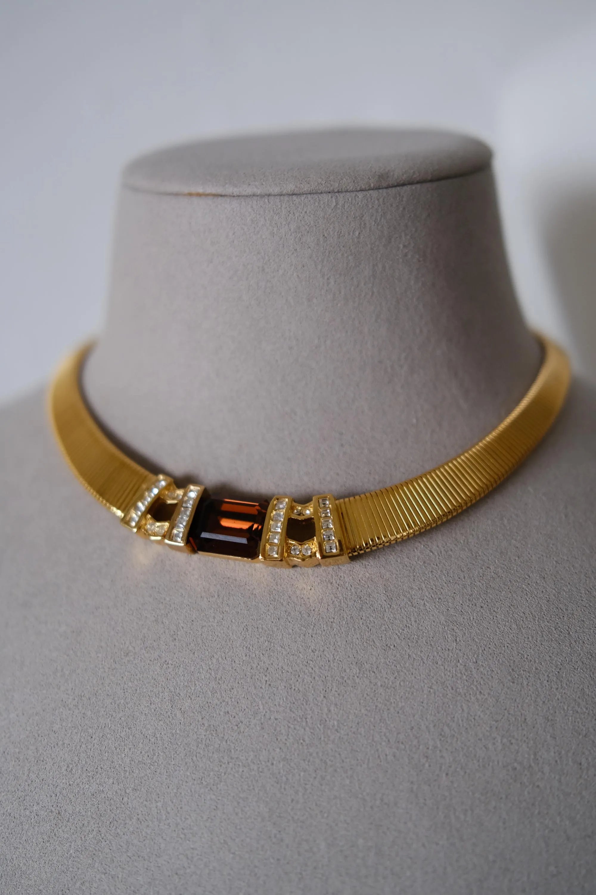 Rare vintage Christian Dior gold-tone ribbed choker necklace with smoky brown faceted crystal centerpiece