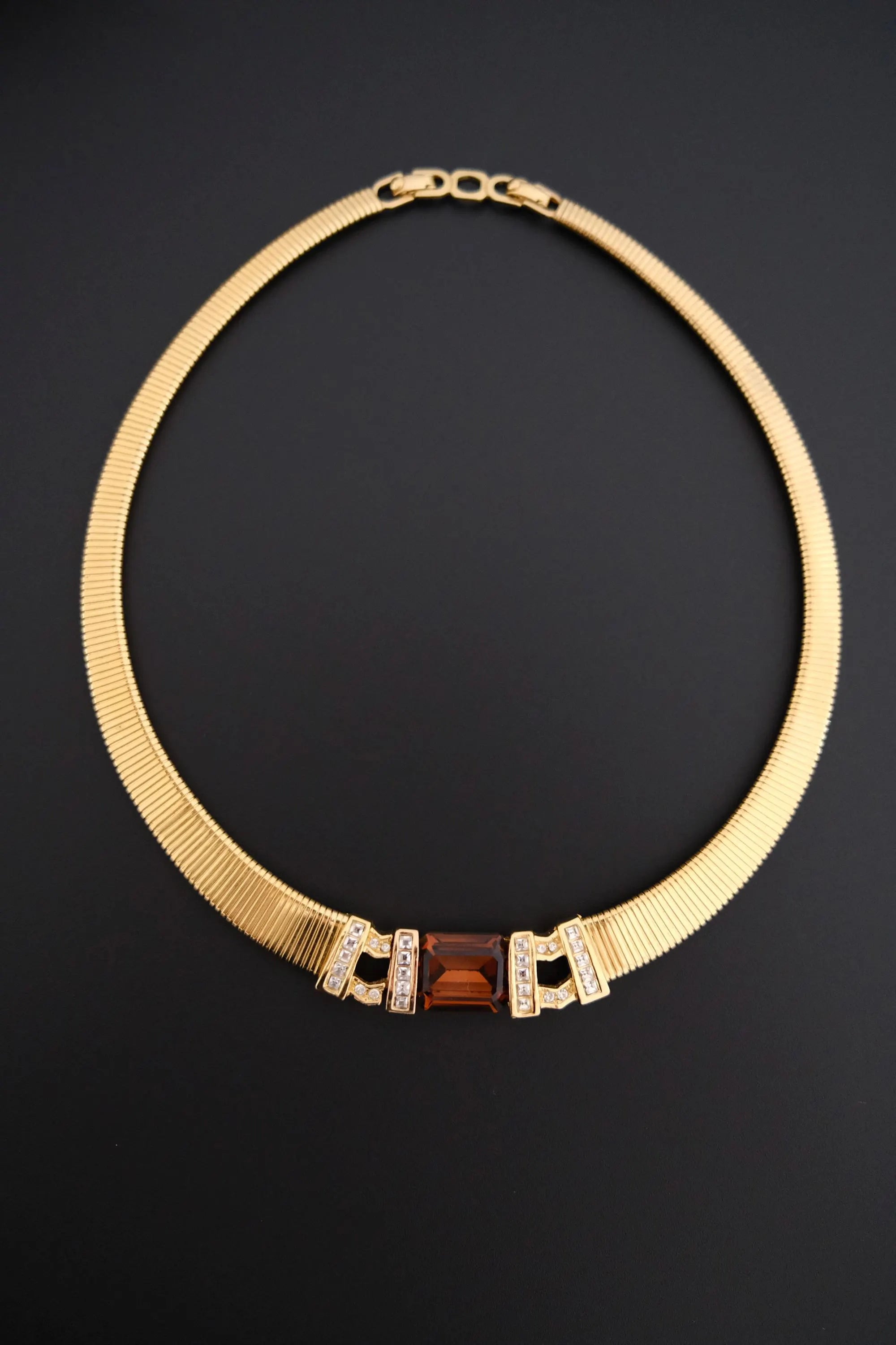 Rare vintage Christian Dior gold-tone ribbed choker necklace with smoky brown faceted crystal centerpiece