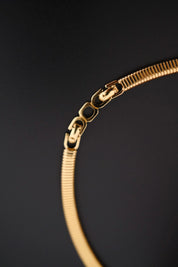 Rare vintage Christian Dior gold-tone ribbed choker necklace with smoky brown faceted crystal centerpiece