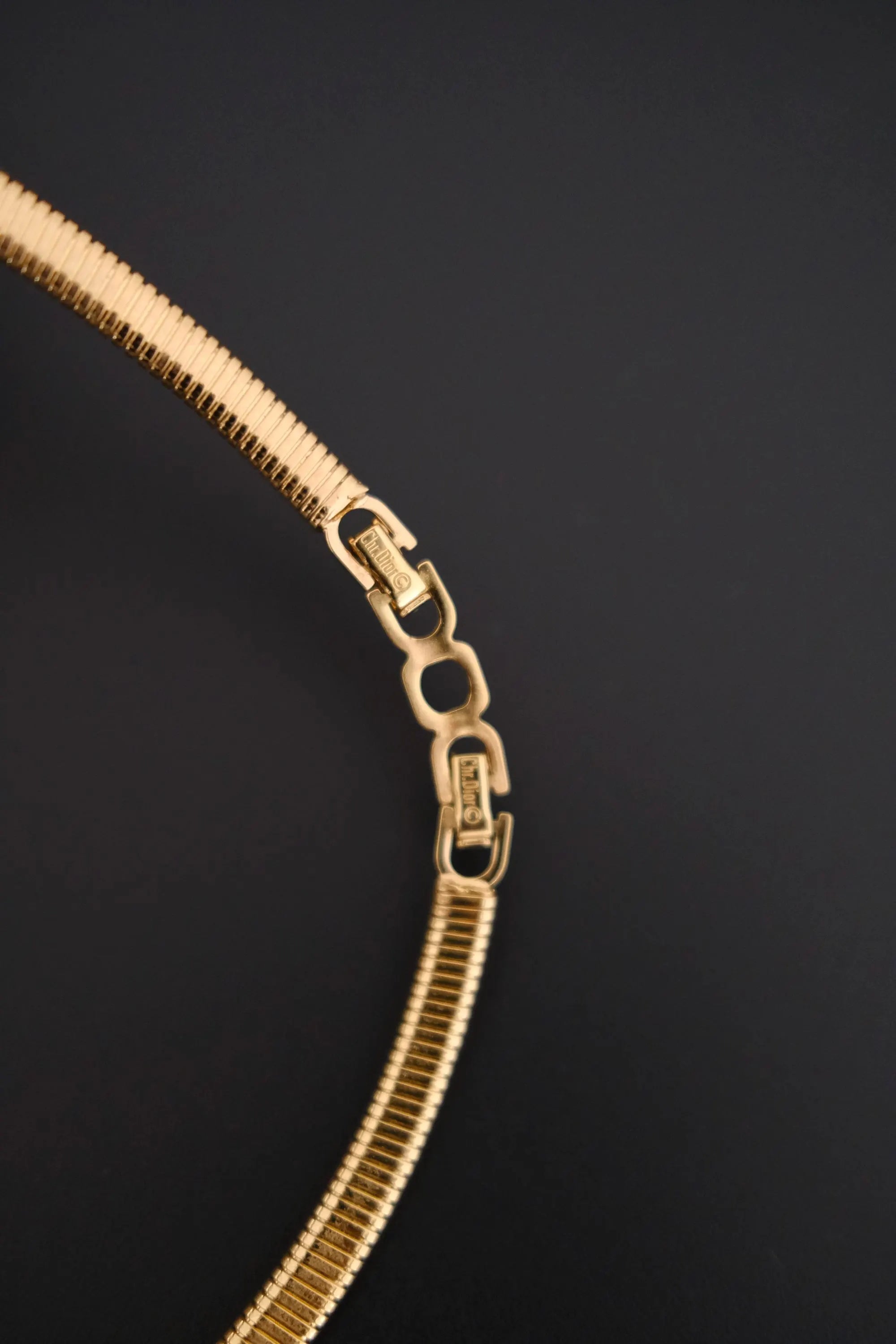 Rare vintage Christian Dior gold-tone ribbed choker necklace with smoky brown faceted crystal centerpiece