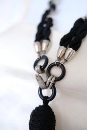 Close-up of long black fringe tassel on vintage Yves Saint Laurent statement necklace