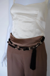 1970s Yves Saint Laurent black braided cord tassel belt styled around the waist
