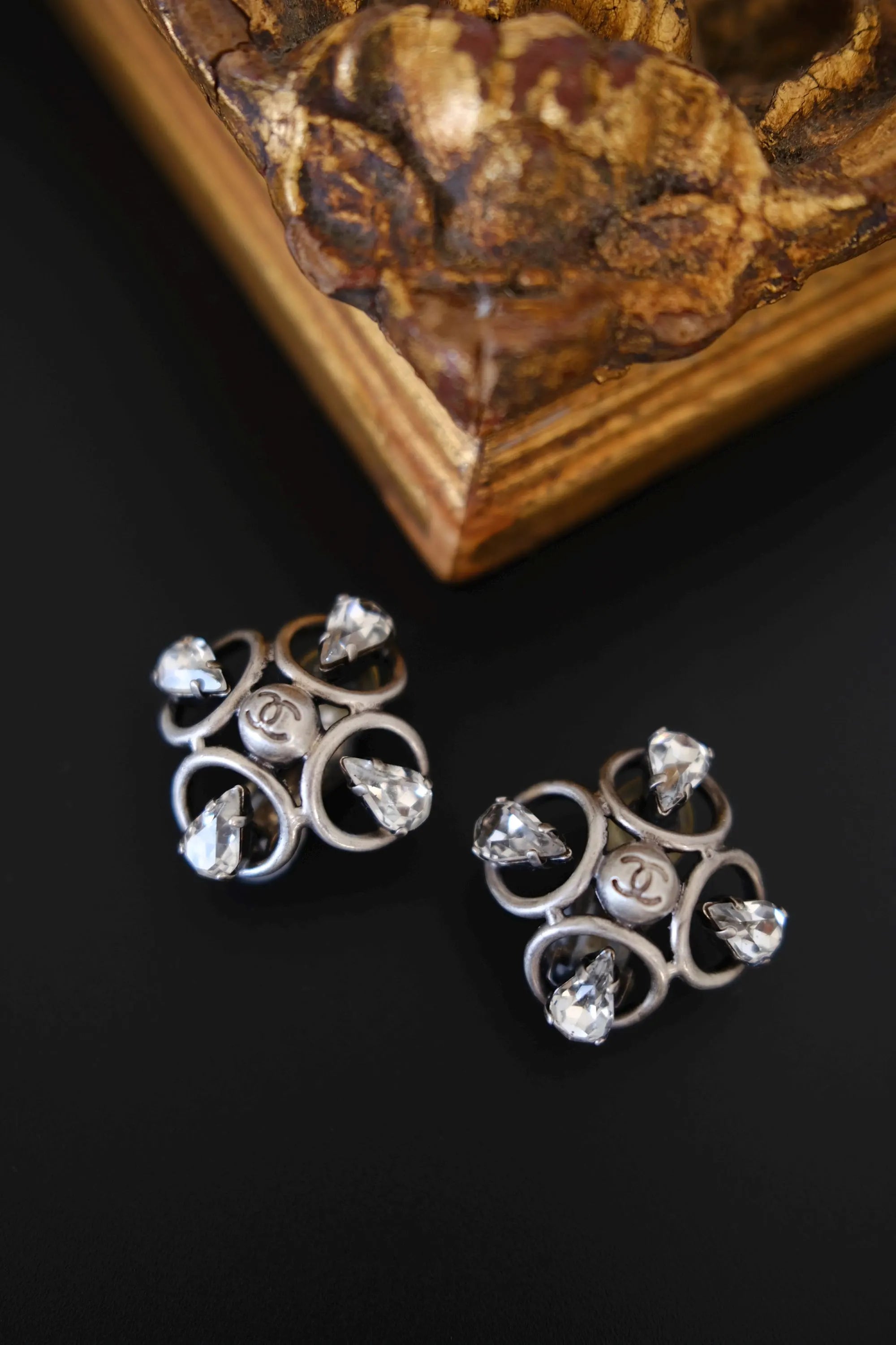 Vintage CHANEL 1996P silver-tone CC clip-on earrings with clear teardrop crystals and sculptural openwork design, made in France