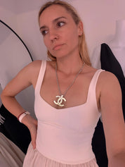Vintage CHANEL silver-tone CC logo statement necklace styled for an elegant look