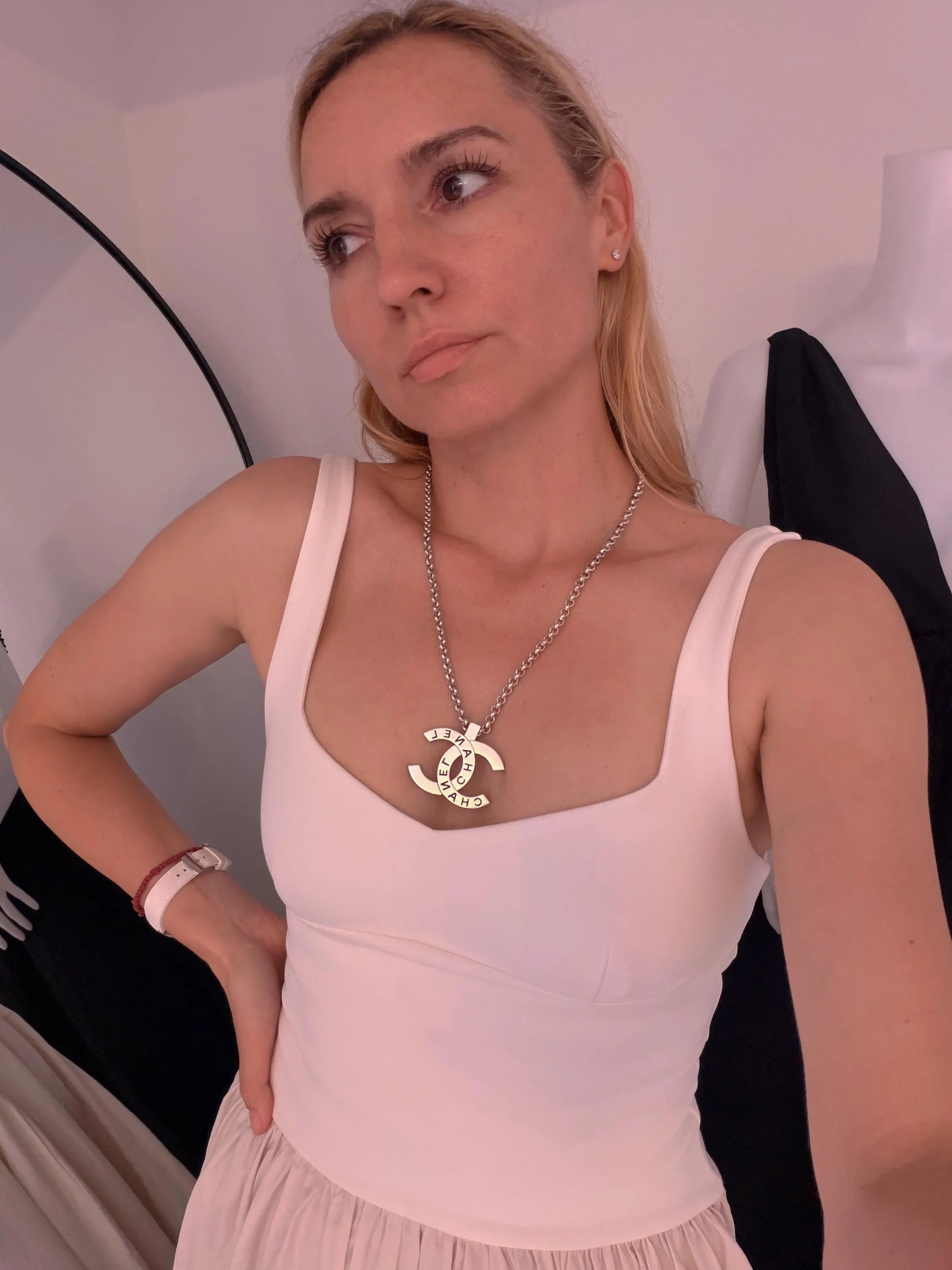 Vintage CHANEL silver-tone CC logo statement necklace styled for an elegant look