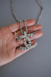 CHANEL 1998 vintage silver-tone interlocking CC logo pendant with CHANEL lettering