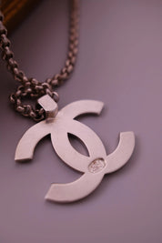 CHANEL 1998 vintage silver-tone interlocking CC logo pendant with CHANEL lettering