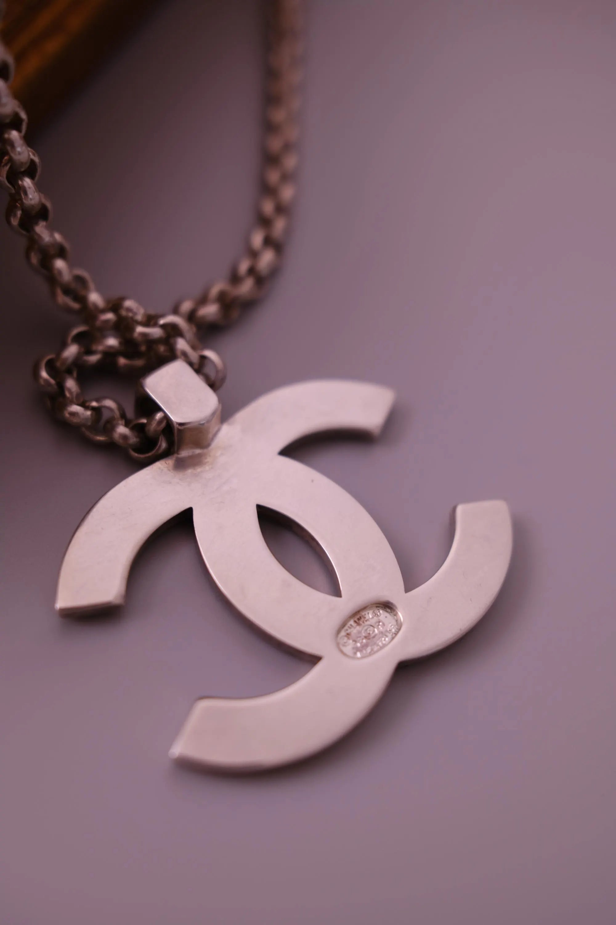 CHANEL 1998 vintage silver-tone interlocking CC logo pendant with CHANEL lettering