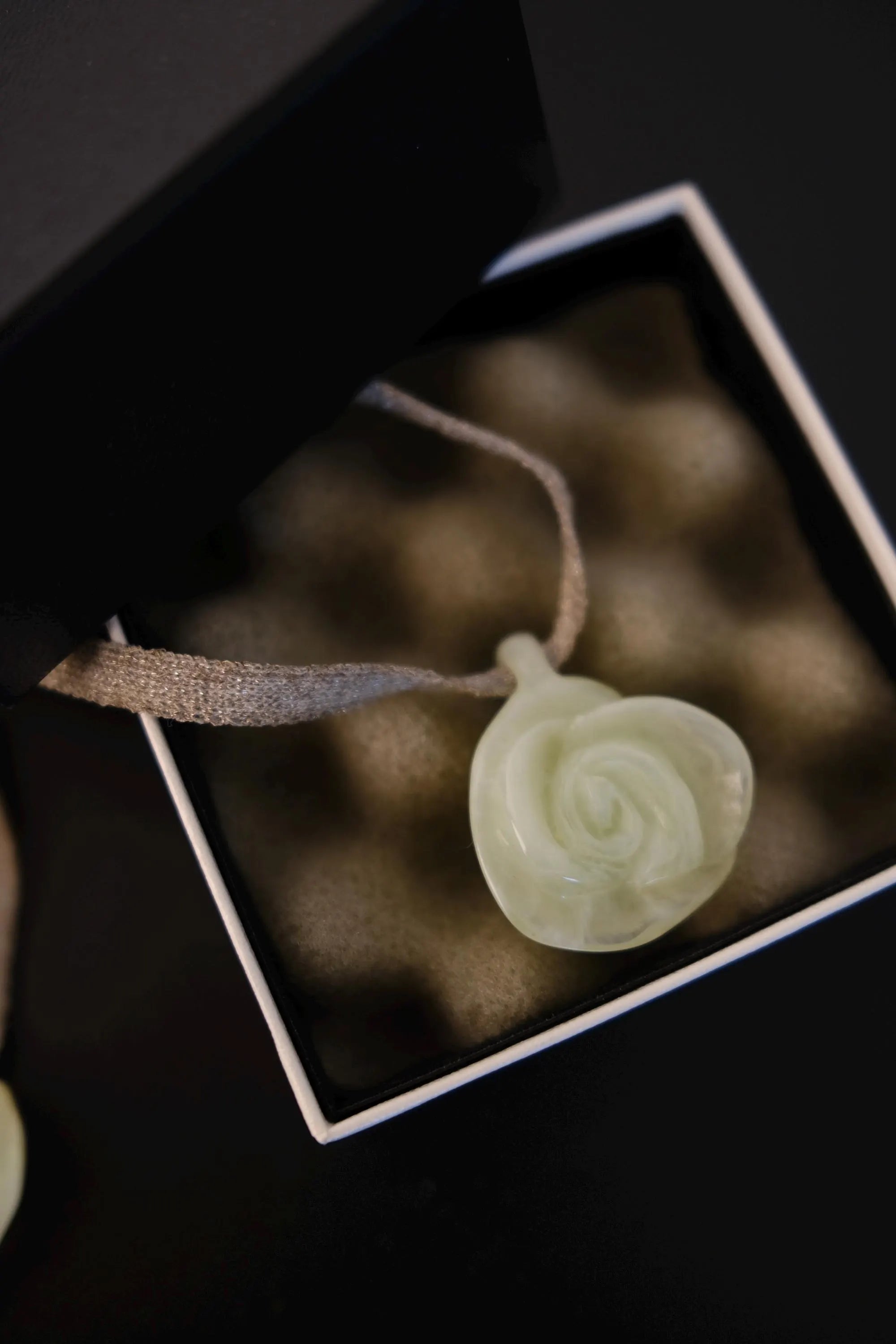 Vintage CHANEL camellia flower pendant necklace in translucent ivory pale mint resin with textile ribbon and box