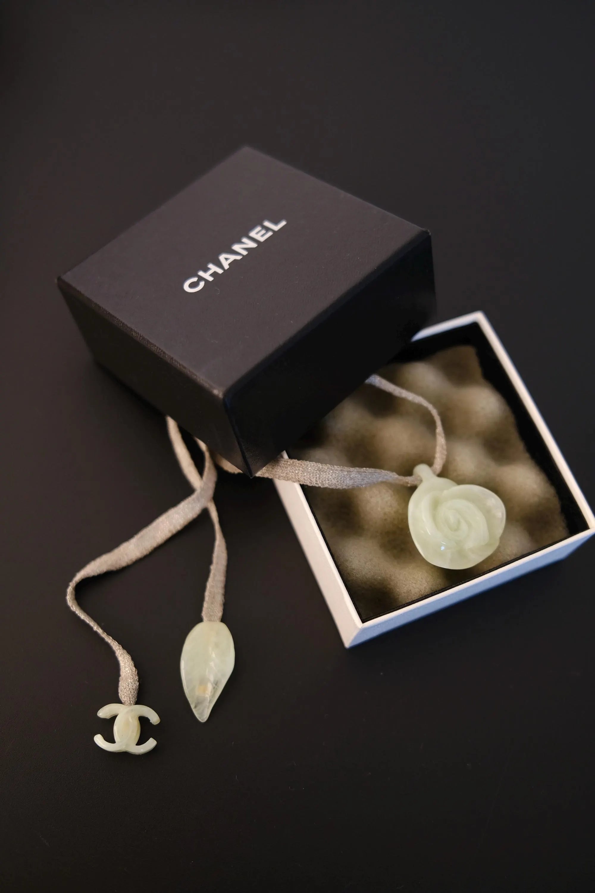 Vintage CHANEL translucent camellia flower pendant necklace presented with accompanying box