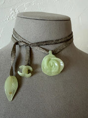 Vintage CHANEL translucent resin camellia flower pendant necklace worn as a long ribbon necklace