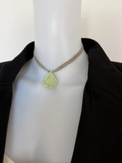CHANEL vintage ivory camellia pendant necklace styled with an elegant black jacket