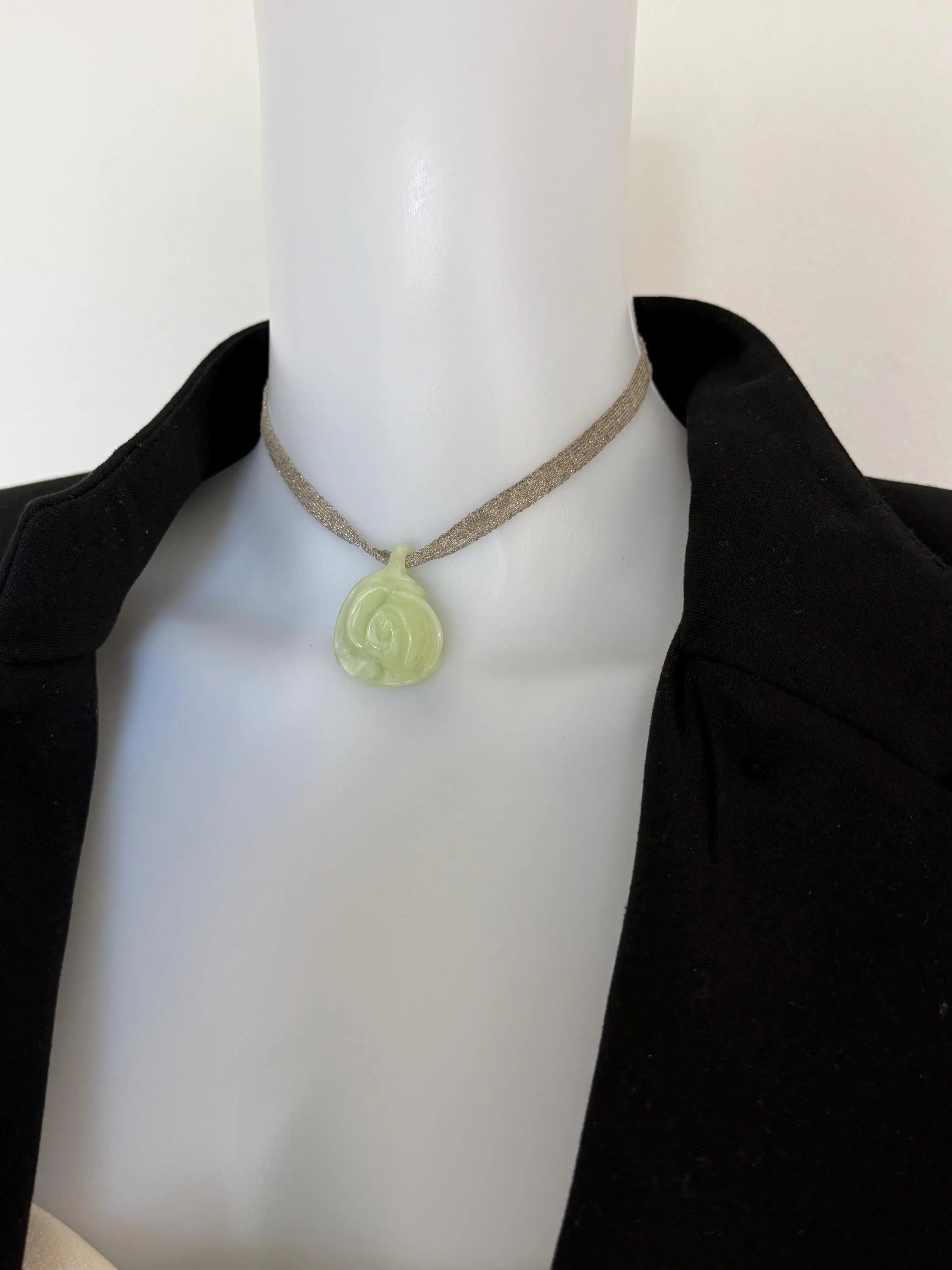 CHANEL vintage ivory camellia pendant necklace styled with an elegant black jacket