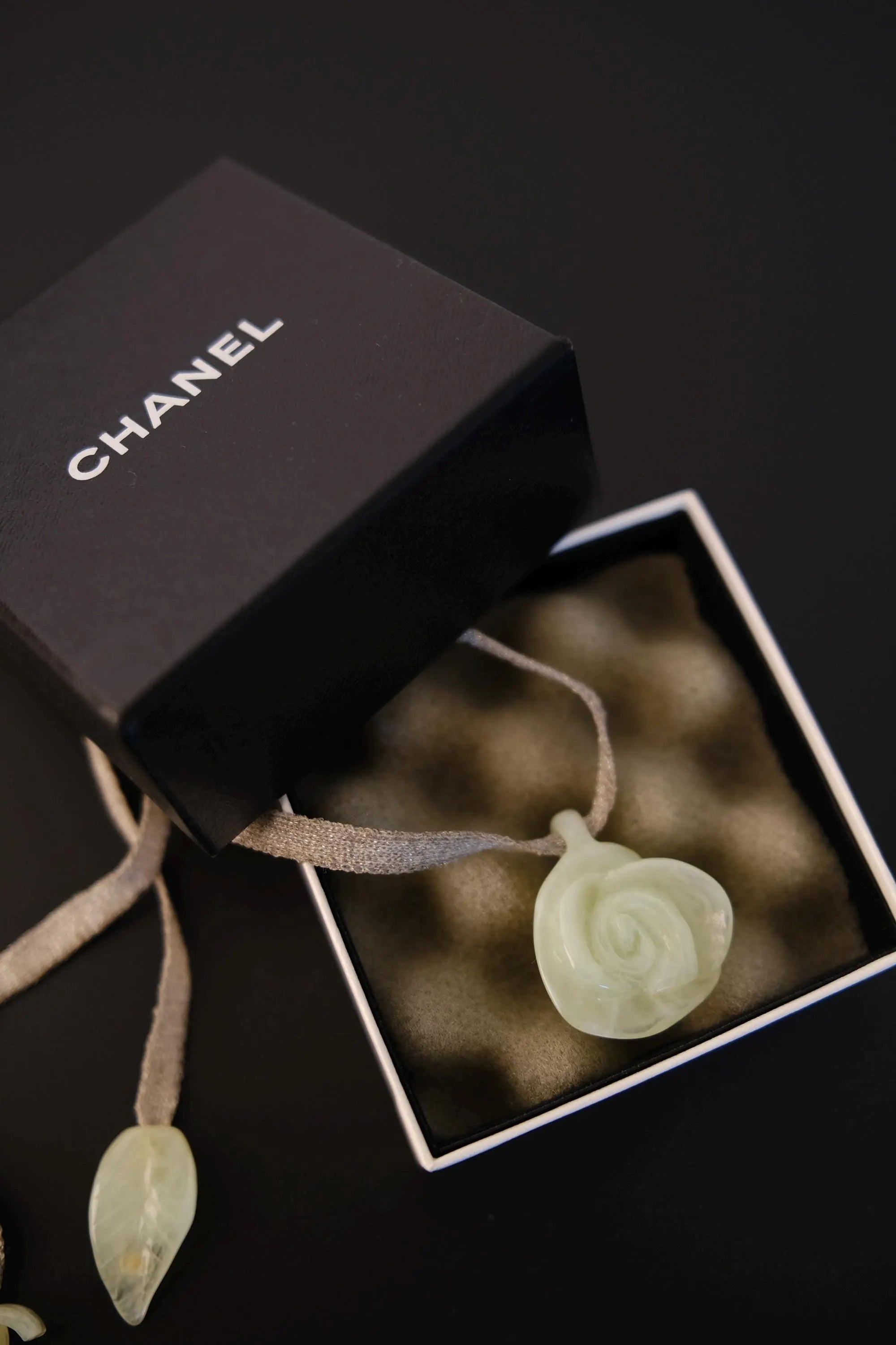 Vintage CHANEL translucent camellia flower pendant necklace presented with accompanying box