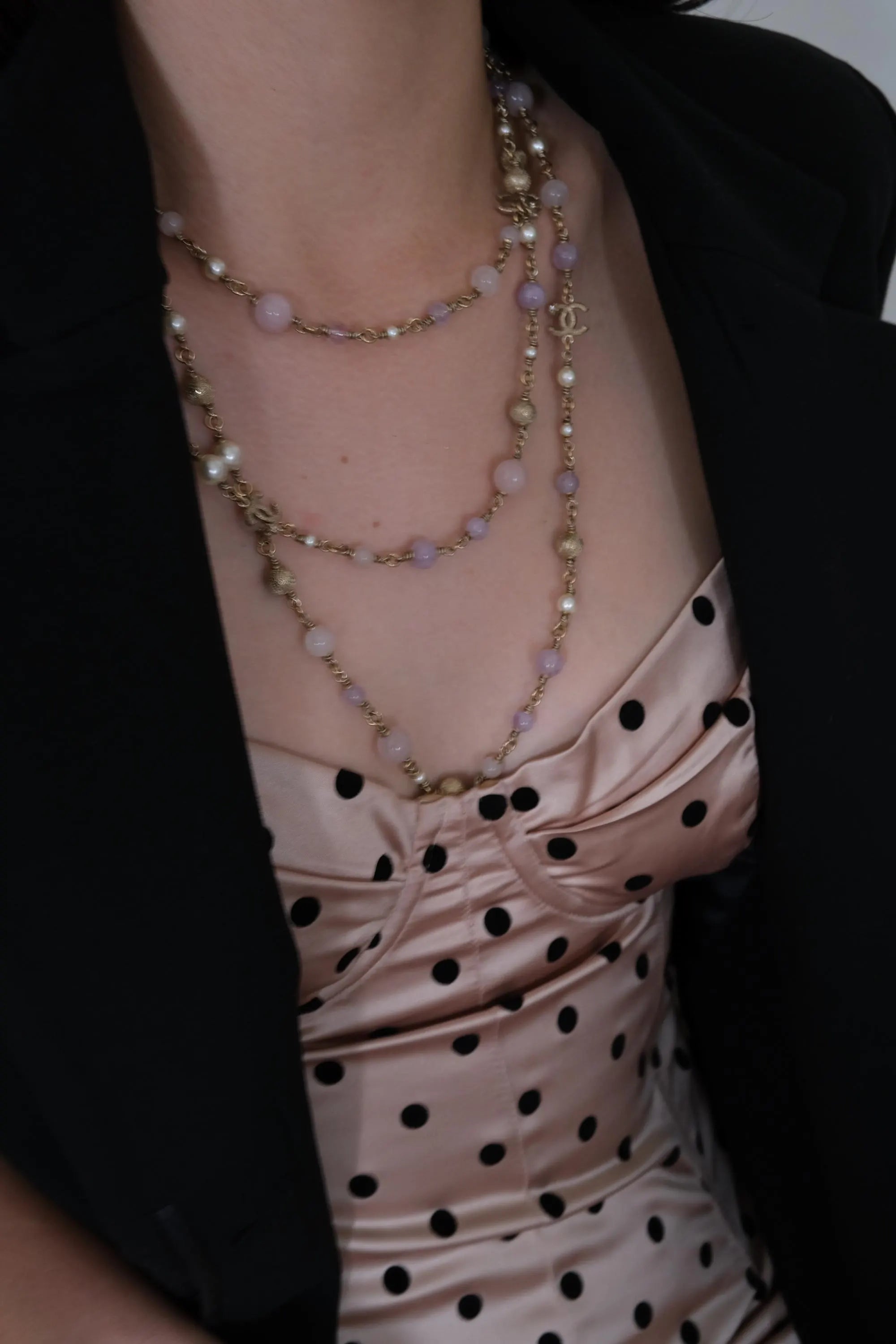 Vintage CHANEL extra-long CC charm necklace wrapped several times around the neckline