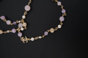 Excellent vintage condition CHANEL Gripoix glass and faux pearl necklace with gold-tone CC charms