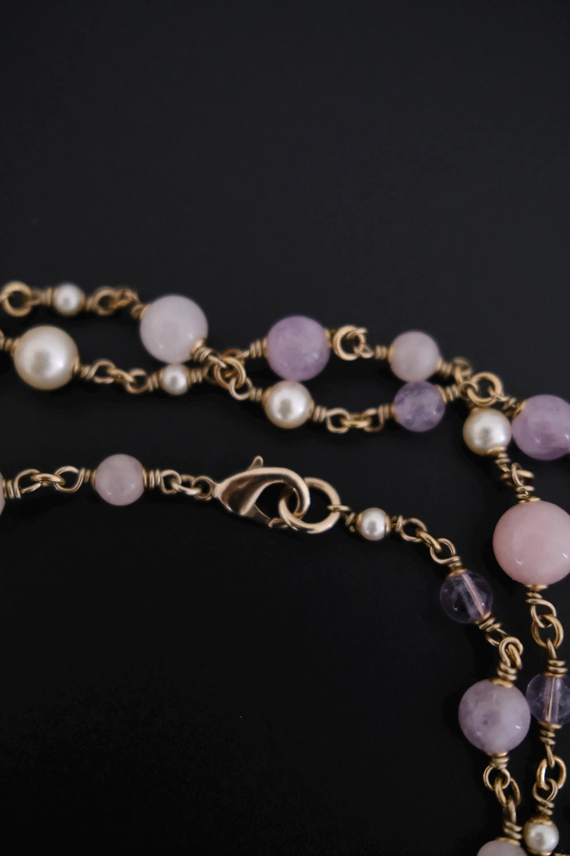 lobster clasp of vintage lavender Gripoix glass and pearl sautoir necklace
