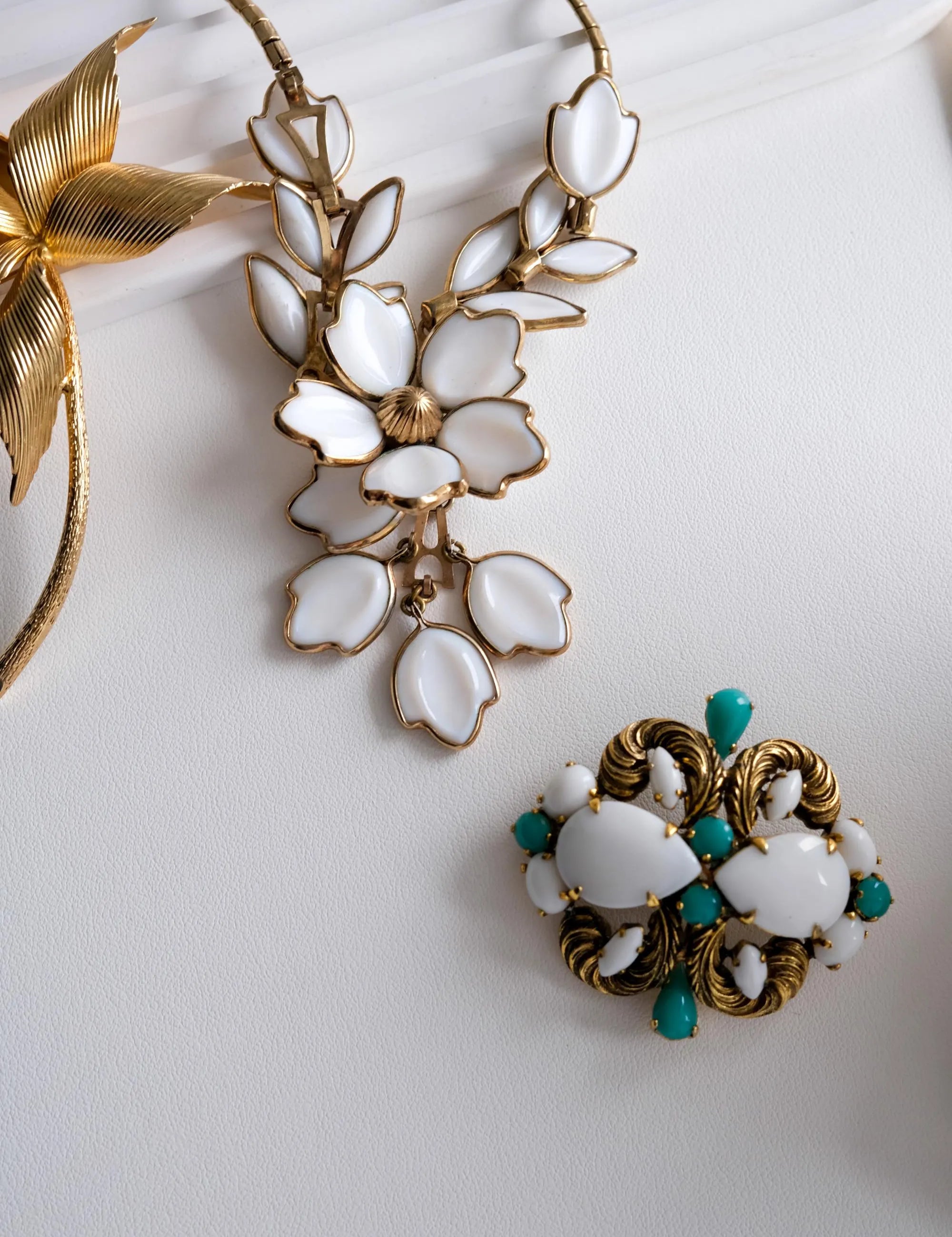 Vintage Christian Dior Germany gold tone brooch with white milk glass and turquoise cabochons