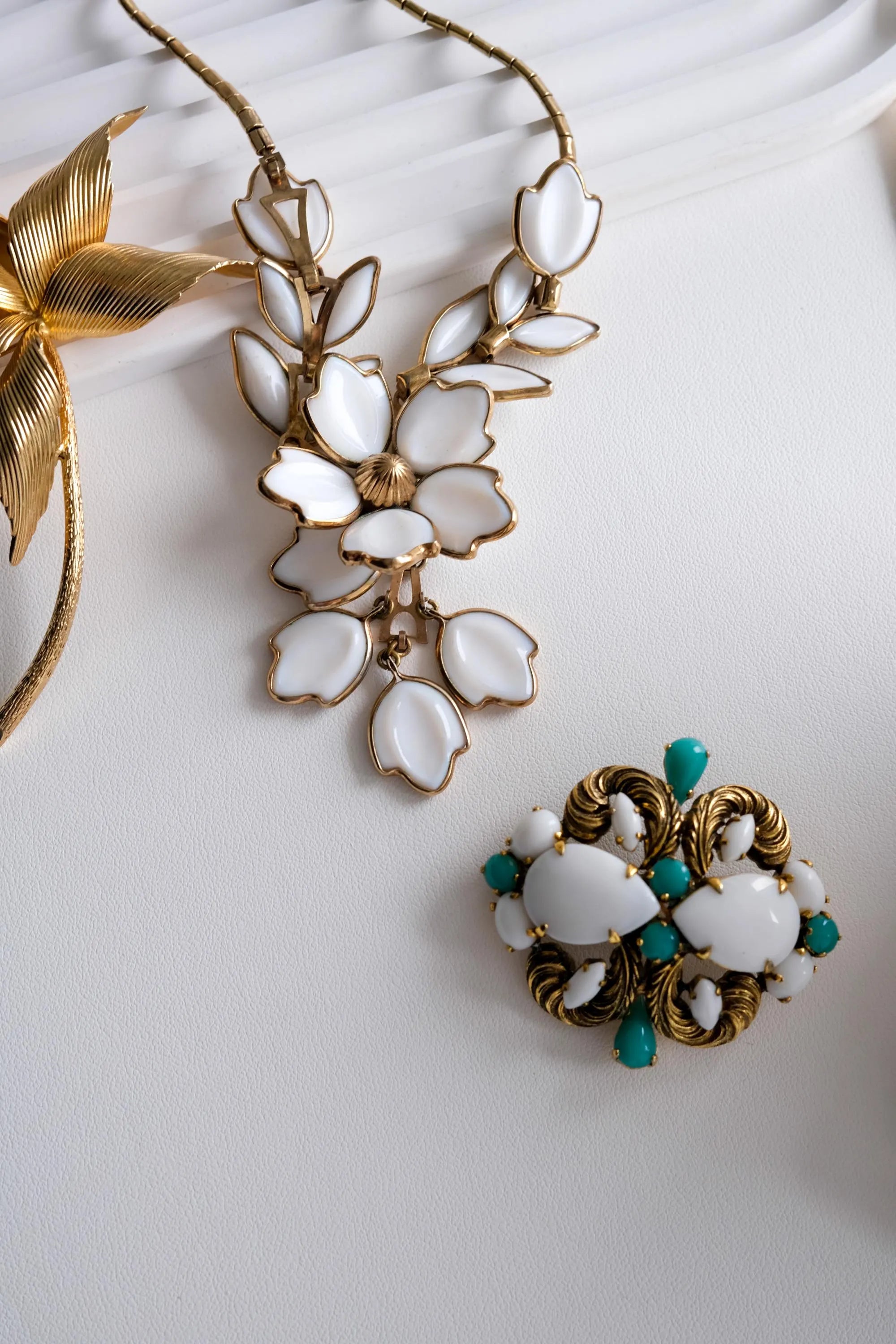 Vintage Christian Dior Germany gold tone brooch with white milk glass and turquoise cabochons