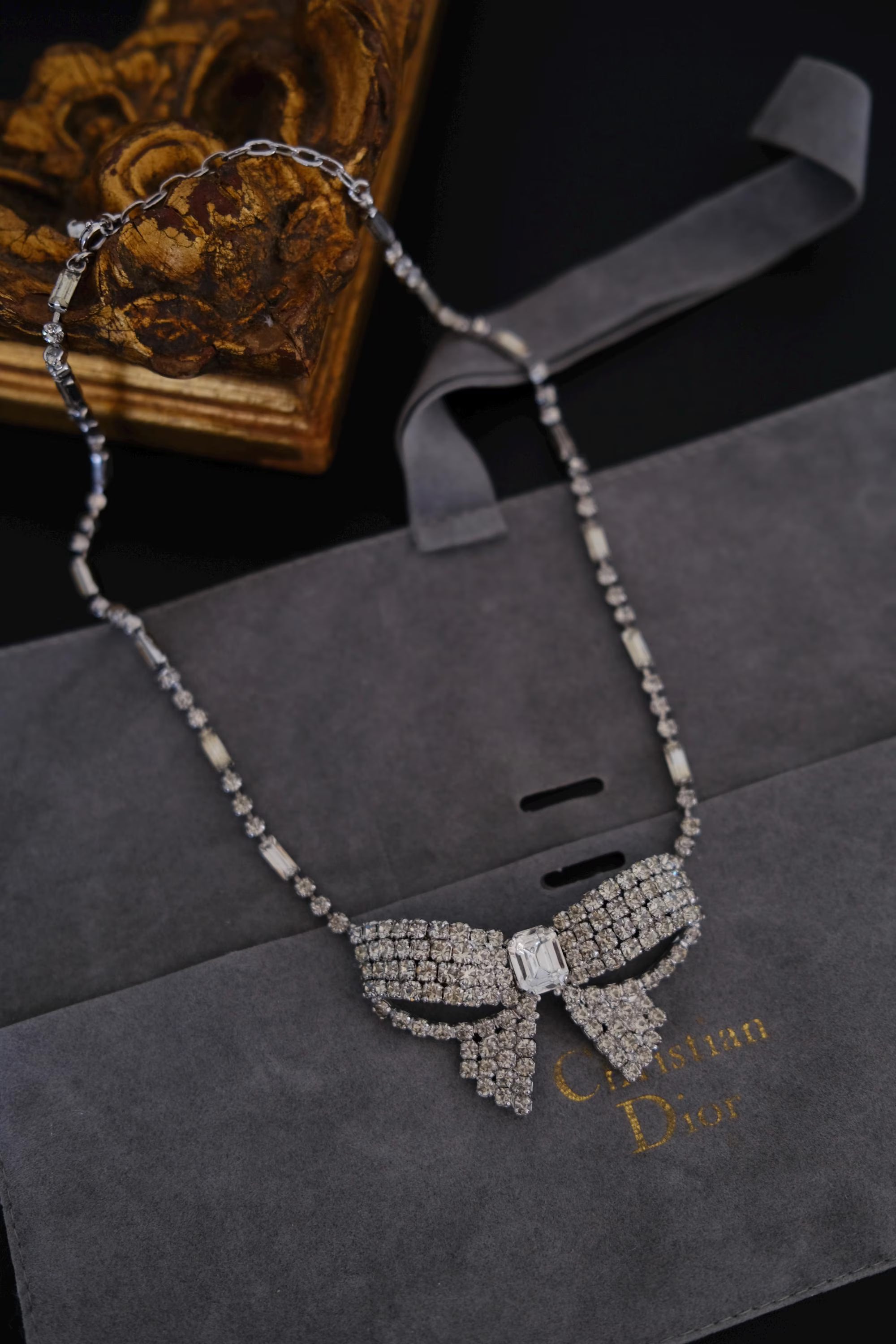 Vintage Christian Dior Germany silver-tone crystal bow ribbon choker necklace with rectangular center crystal and original Dior packaging