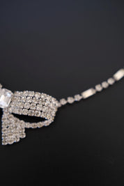 Angled close-up of dimensional layered crystal bow construction on vintage Christian Dior statement necklace