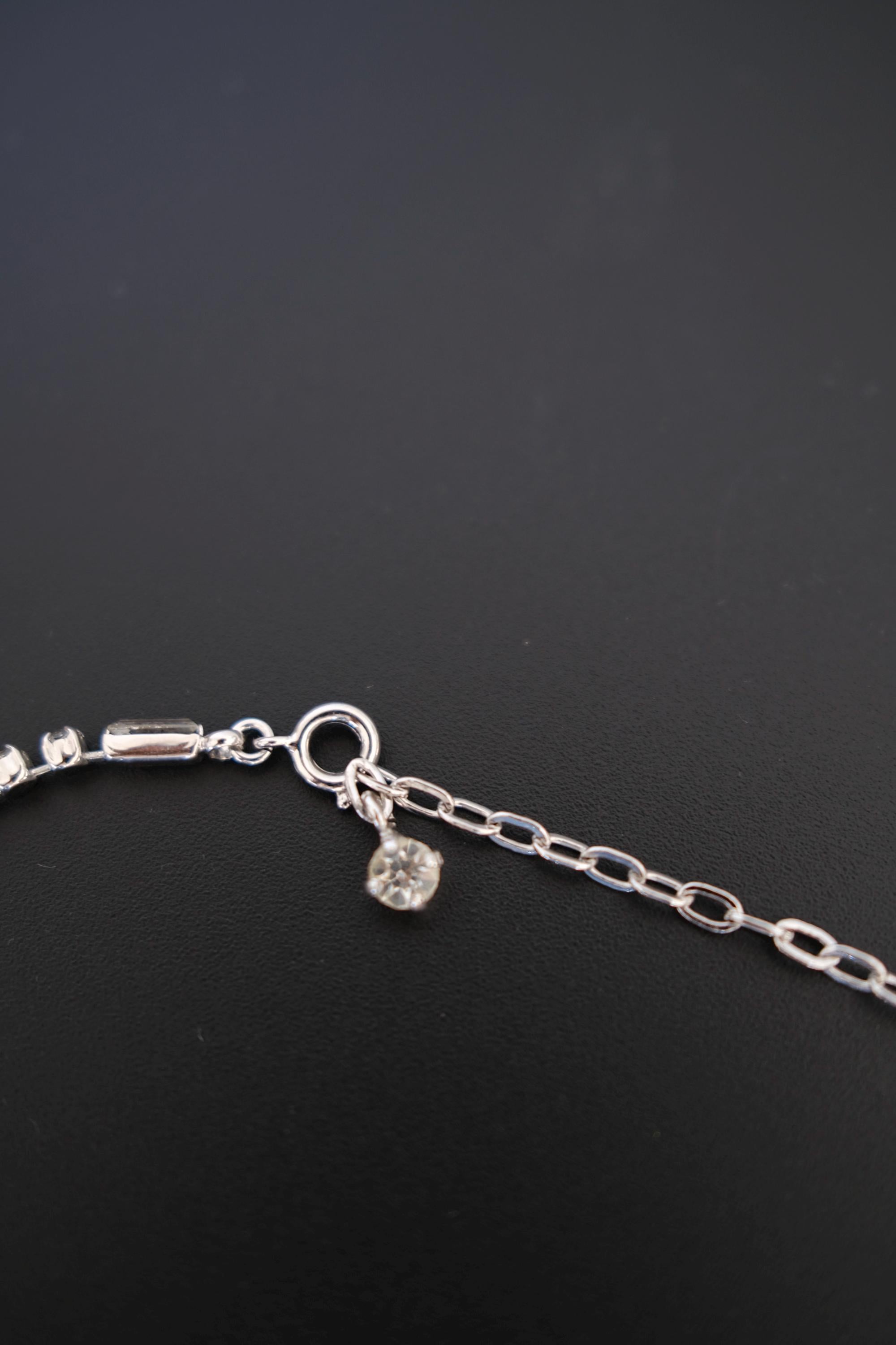 Detail of adjustable clasp and extension chain on vintage Christian Dior crystal bow choker necklace