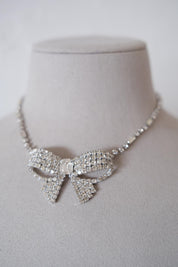 Vintage Christian Dior crystal ribbon bow choker worn at the neckline as an elegant statement necklace