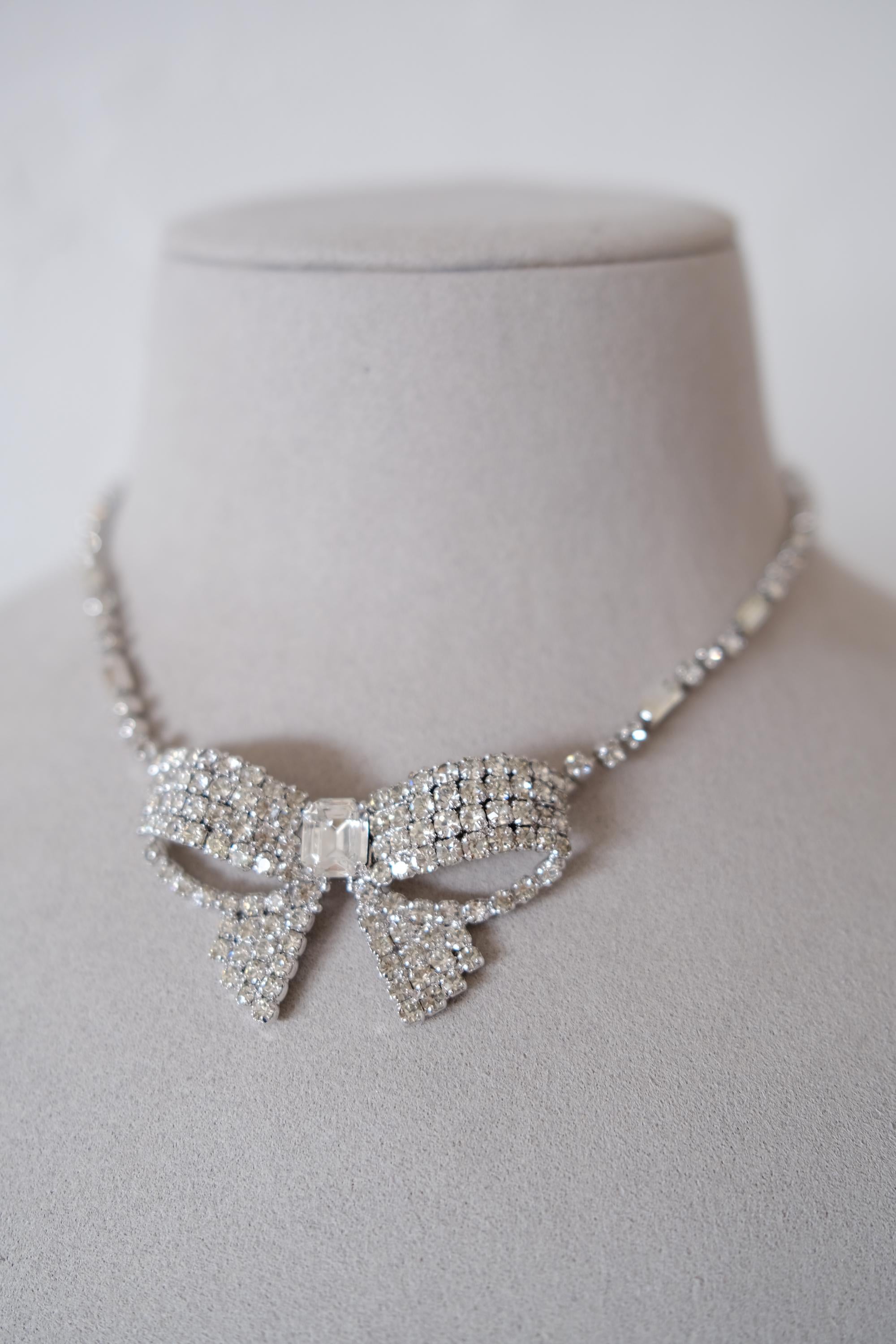Vintage Christian Dior crystal ribbon bow choker worn at the neckline as an elegant statement necklace