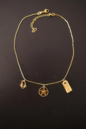 Vintage Christian Dior gold three charm necklace measuring approximately 43 cm long with adjustable extender