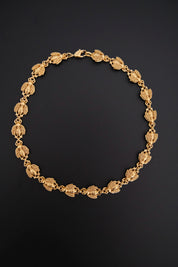 Vintage Christian Dior gold-tone necklace featuring 19 sculptural bee motifs, signed Dior Germany