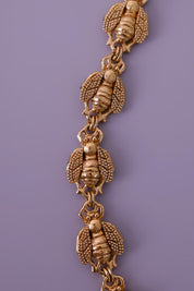 Vintage Christian Dior gold-tone necklace featuring 19 sculptural bee motifs, signed Dior Germany