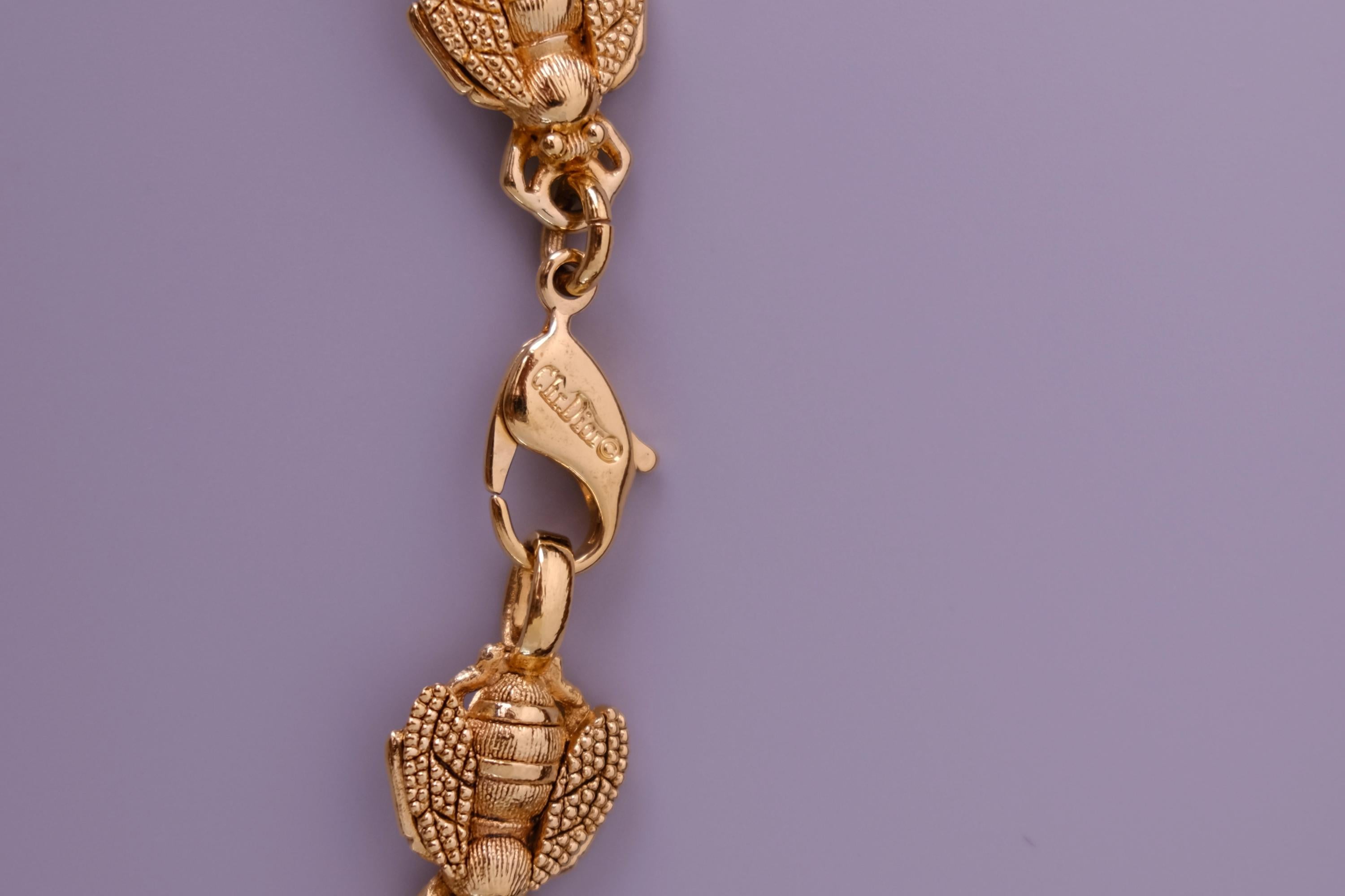 Vintage Christian Dior gold-tone necklace featuring 19 sculptural bee motifs, signed Dior Germany