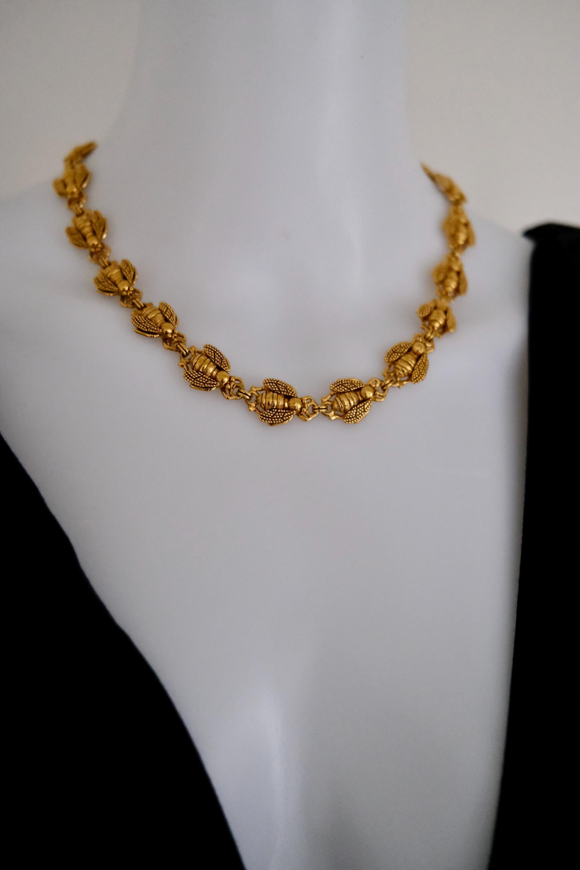 Vintage Christian Dior gold-tone necklace featuring 19 sculptural bee motifs, signed Dior Germany