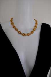 Vintage Christian Dior gold-tone necklace featuring 19 sculptural bee motifs, signed Dior Germany