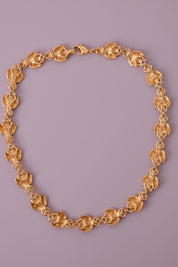 Vintage Christian Dior gold-tone necklace featuring 19 sculptural bee motifs, signed Dior Germany