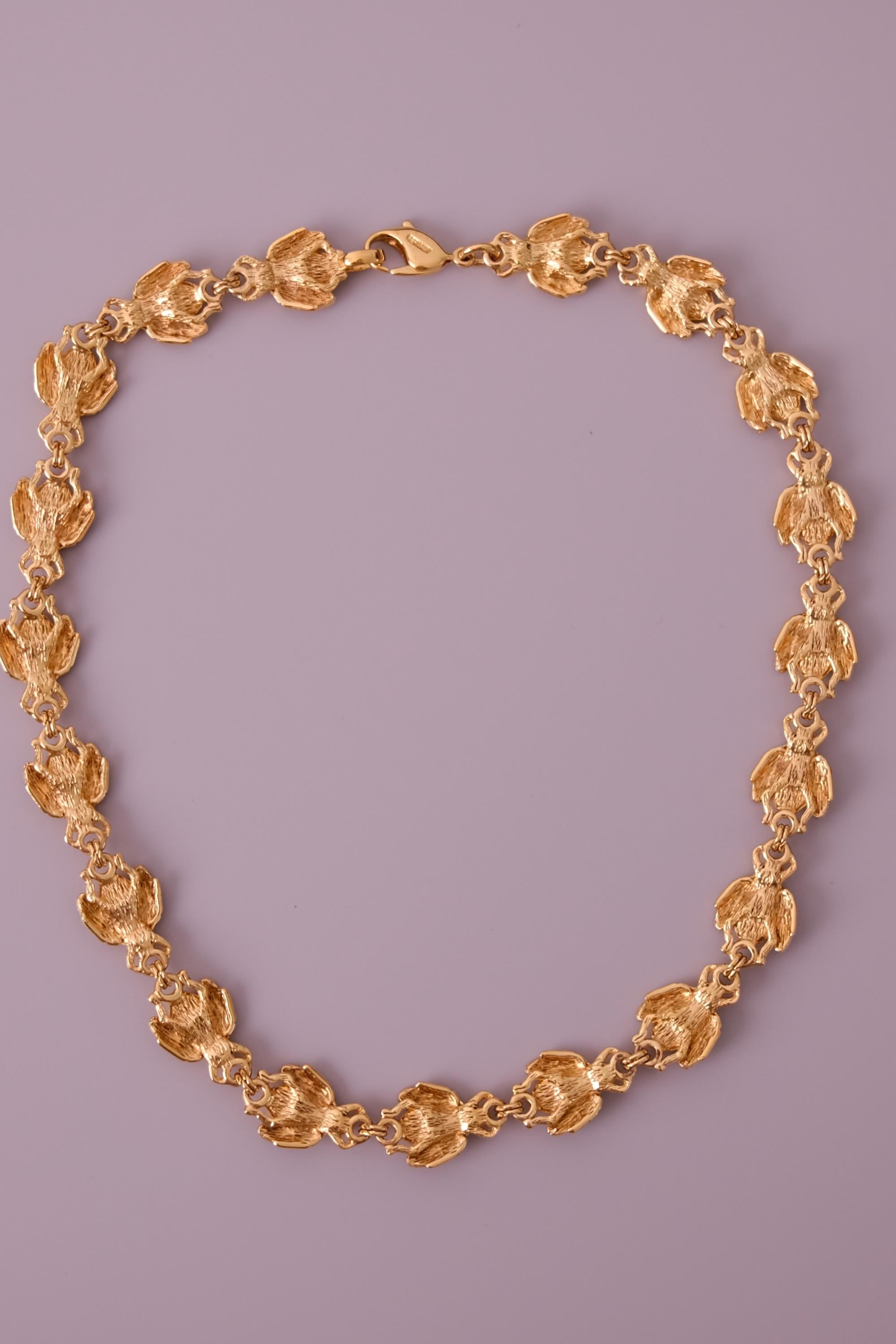 Vintage Christian Dior gold-tone necklace featuring 19 sculptural bee motifs, signed Dior Germany