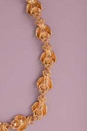 Vintage Christian Dior gold-tone necklace featuring 19 sculptural bee motifs, signed Dior Germany
