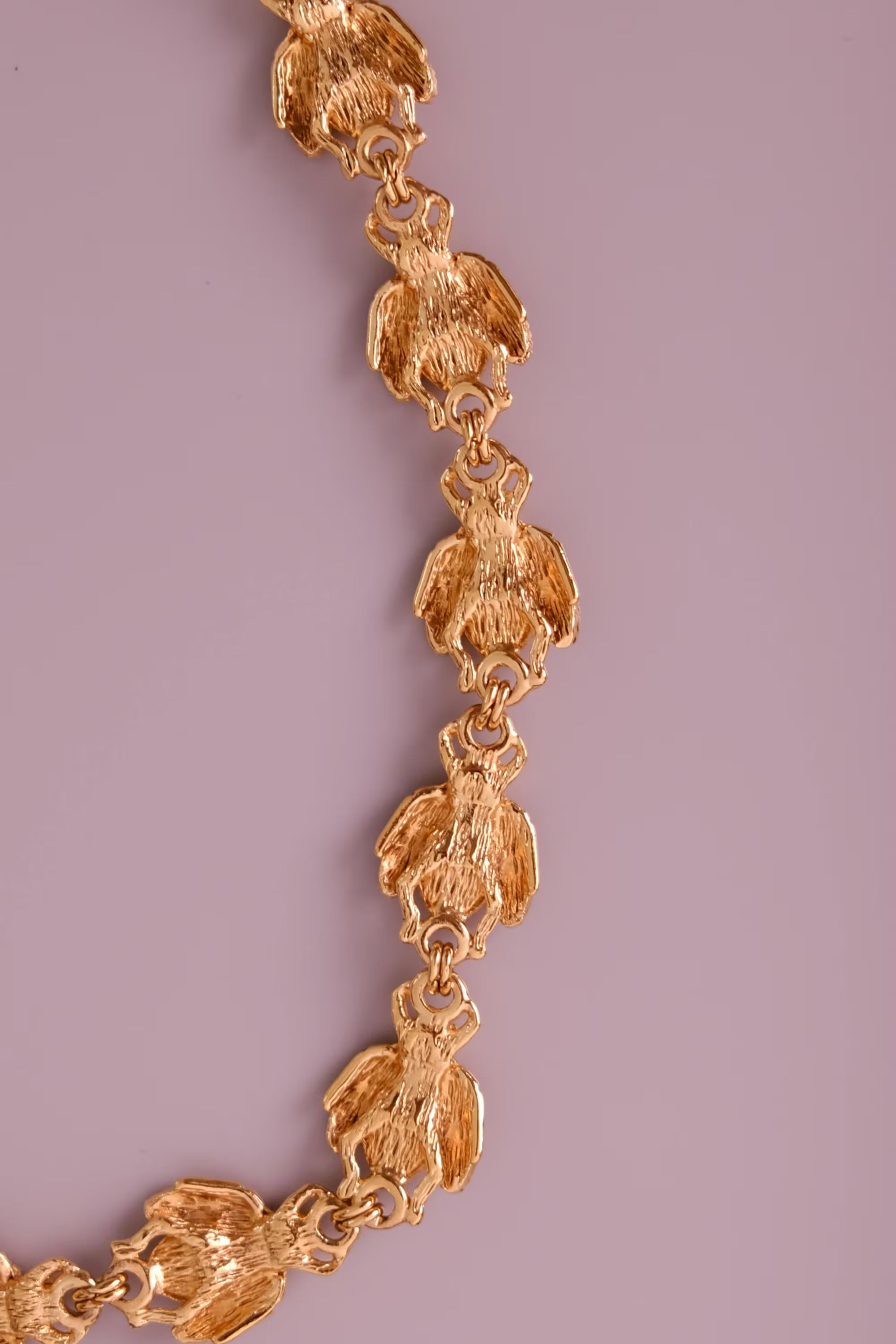 Vintage Christian Dior gold-tone necklace featuring 19 sculptural bee motifs, signed Dior Germany